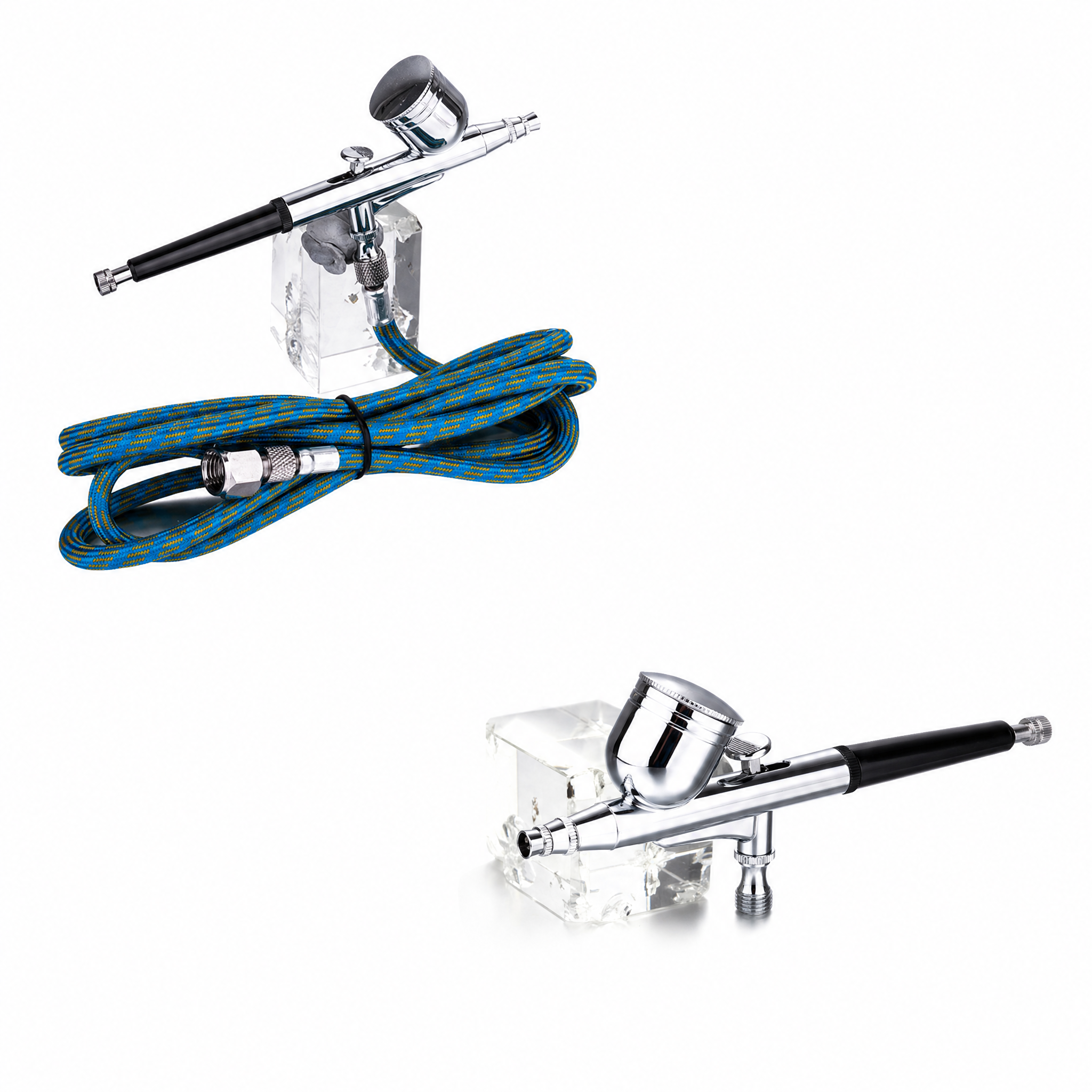 Airbrush kit components arranged for product comparison